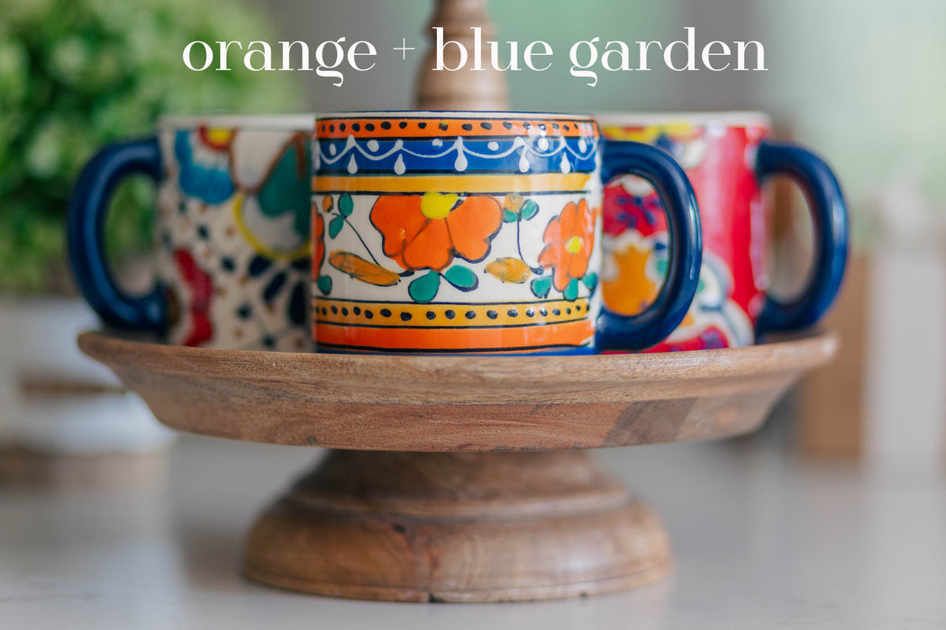 12.5 oz handcrafted ceramic coffee mug [orange + blue garden]